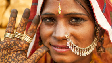 indian woman wearing traditional clothes smiling to camera