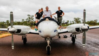 people standing on a small plane