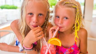 girls drinking through straws