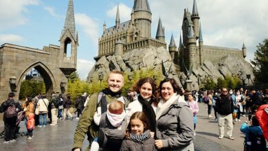 people standing in front of a castle