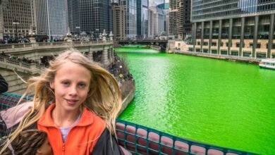 girl posing inf ront of Green Chicago River (1)