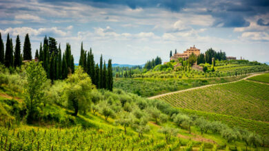 hilly mountains with villa on top in tuscany